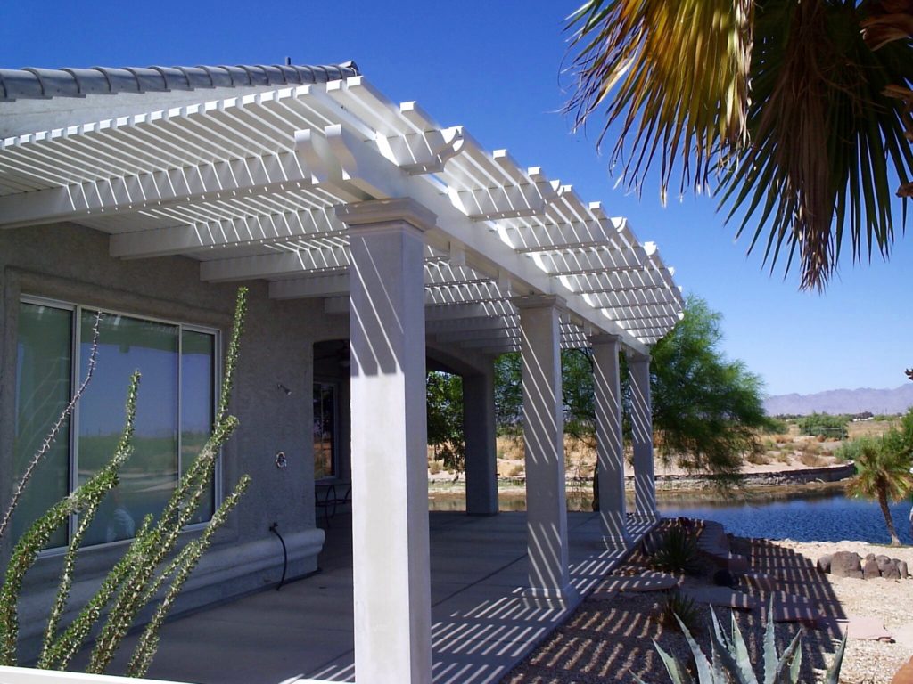 White lattice patio cover shade water