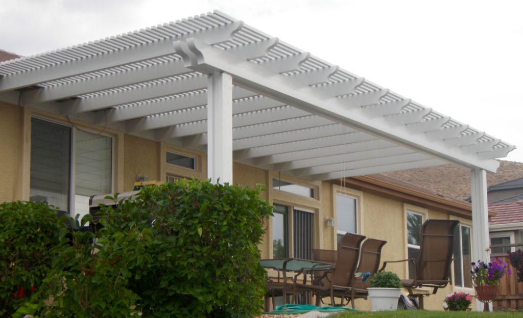 White Lattice Patio Cover and Brown Chairs