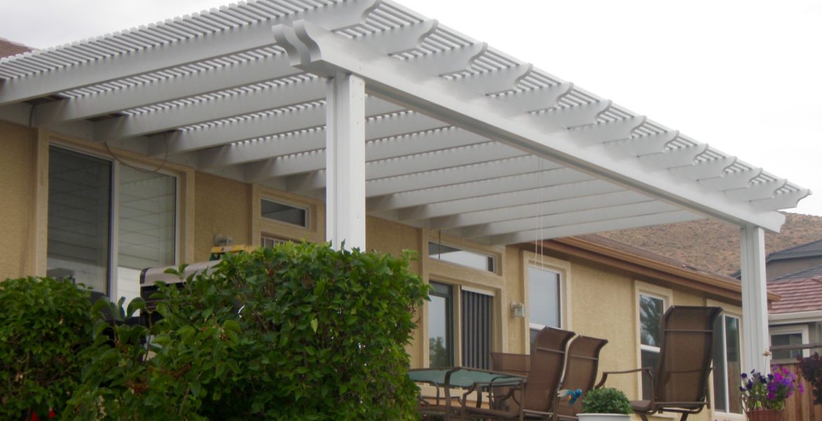 White Lattice Patio Cover and Brown Chairs