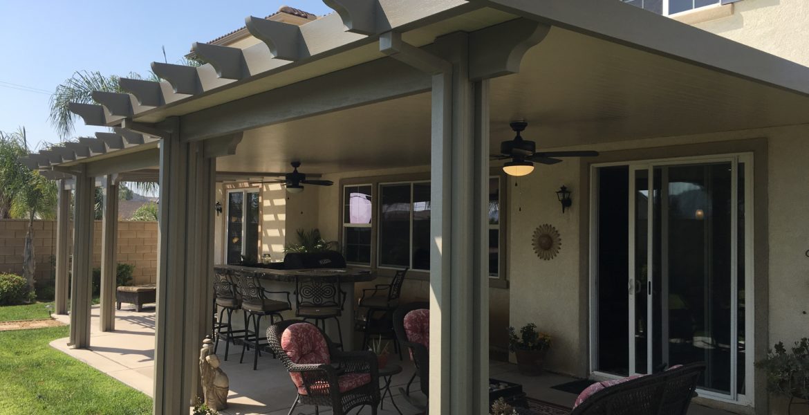 Outdoor space with a covered solid patio and outdoor furniture