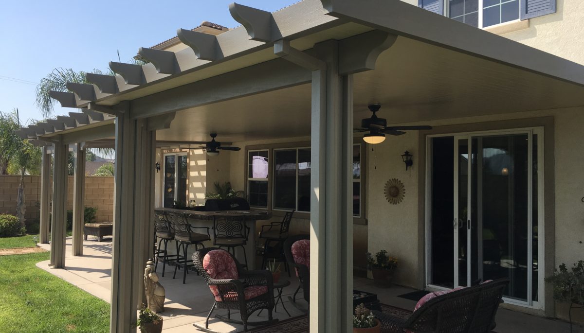 Outdoor space with a covered solid patio and outdoor furniture