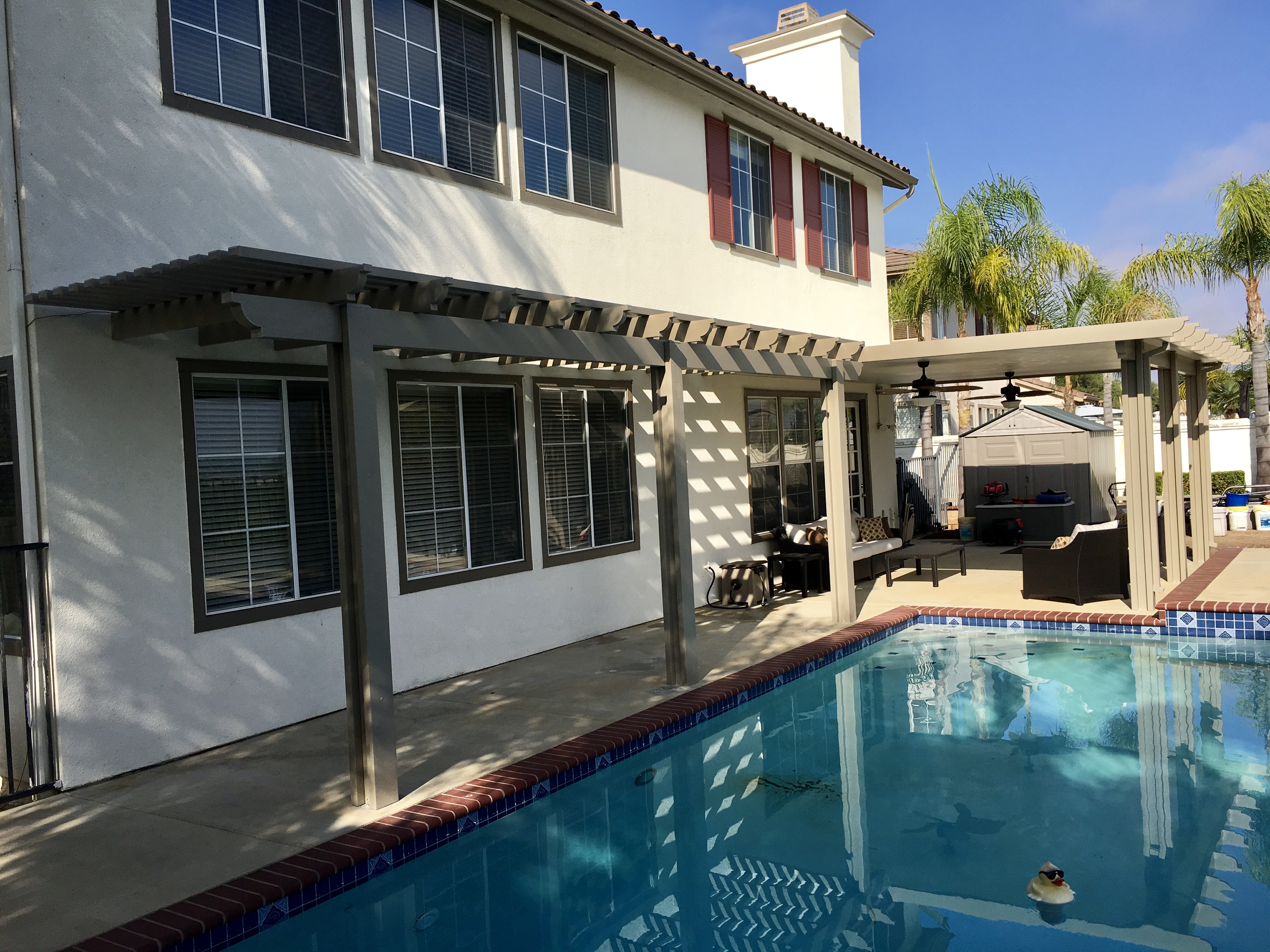 Light brown combination patio covers by pool