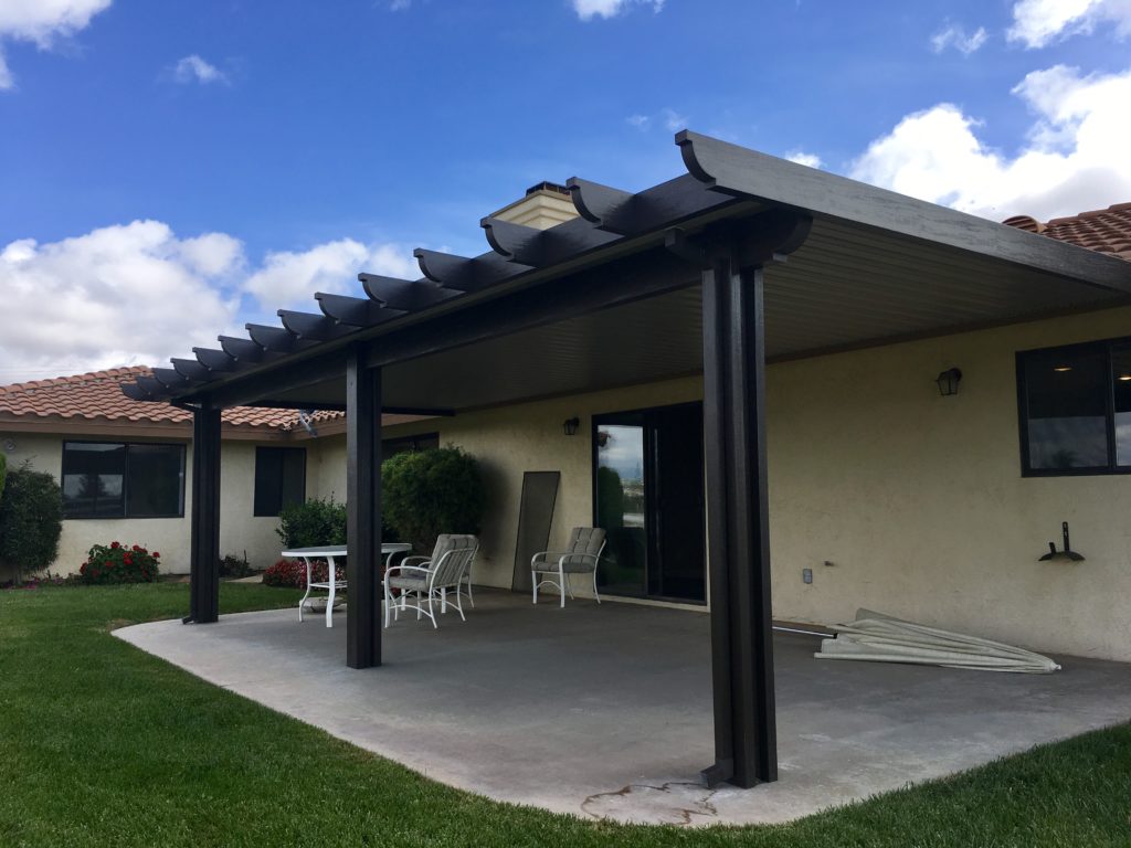 Outdoor living space with aluminium patio cover and furniture