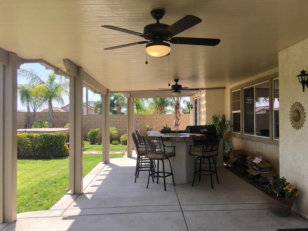 Combination solid and lattice patio cover with Cameo ceiling and Adobe trim over an outdoor bar in Wildomar CA