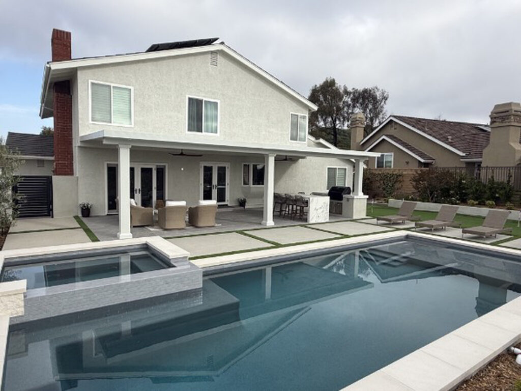 Solid aluminum patio cover on a two-story home overlooking a pool and spa in Lake Forest, CA