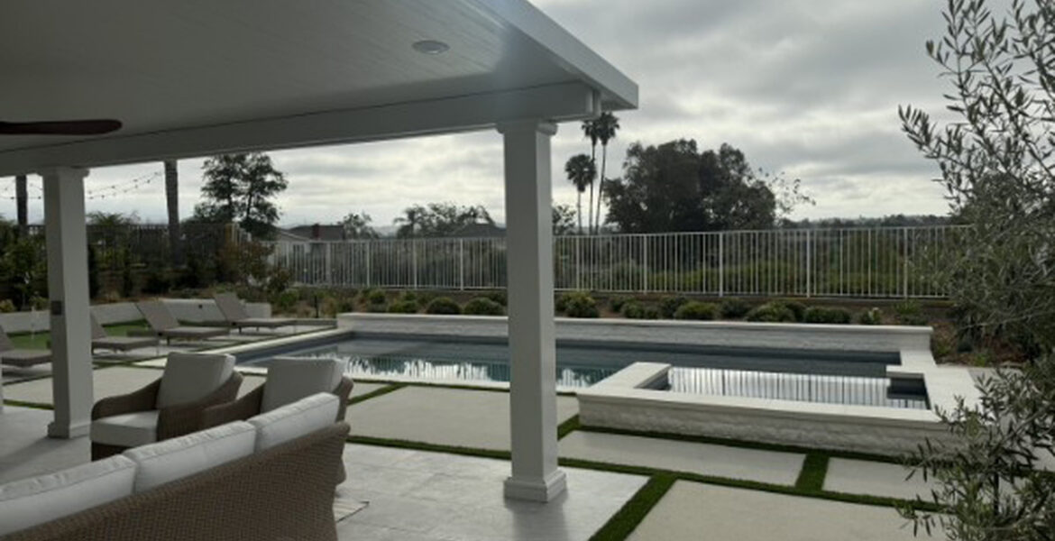Solid aluminum patio cover beside a pool and spa with panoramic views in Lake Forest, CA