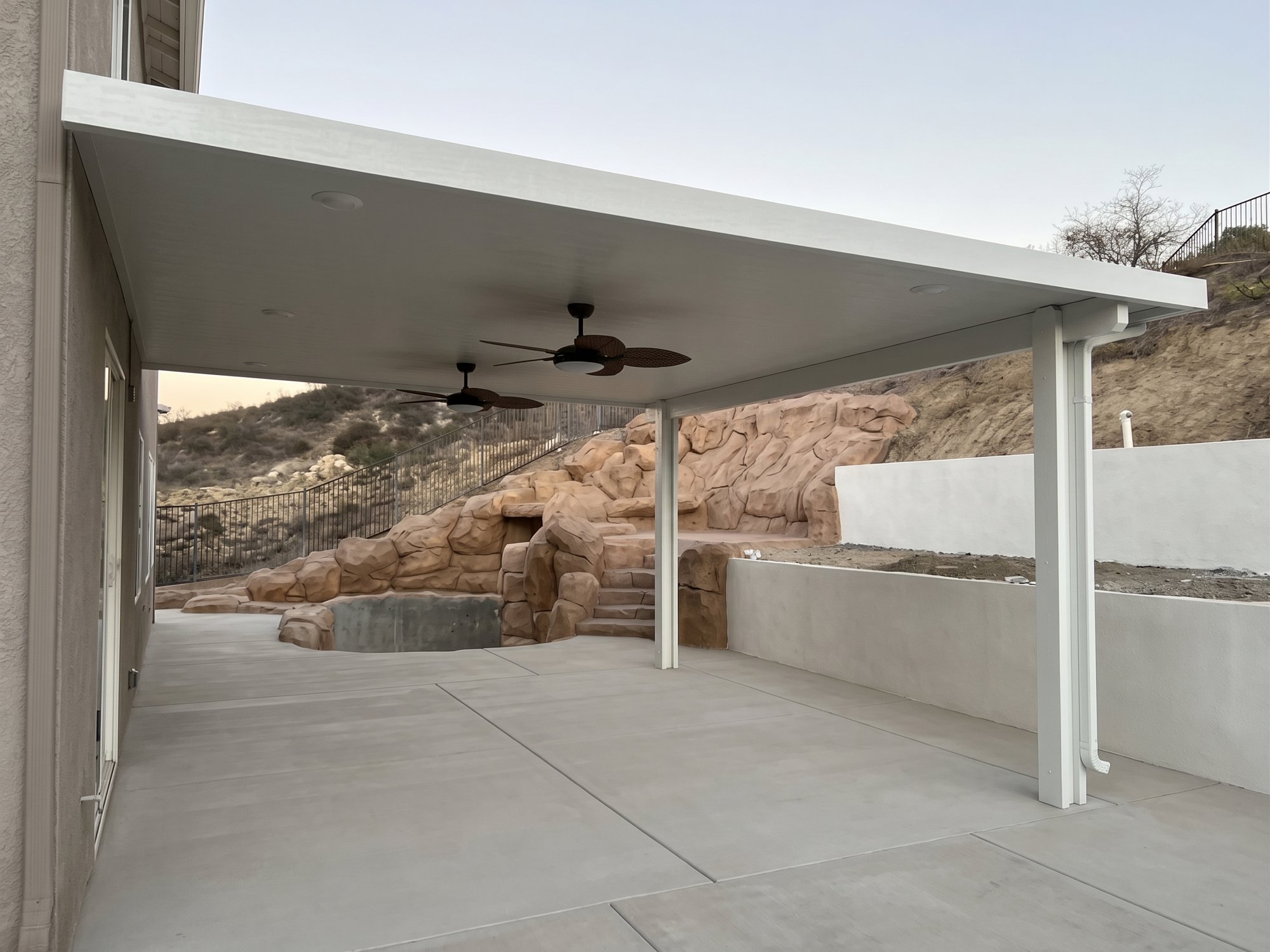 White solid aluminum patio cover after installation in Corona.