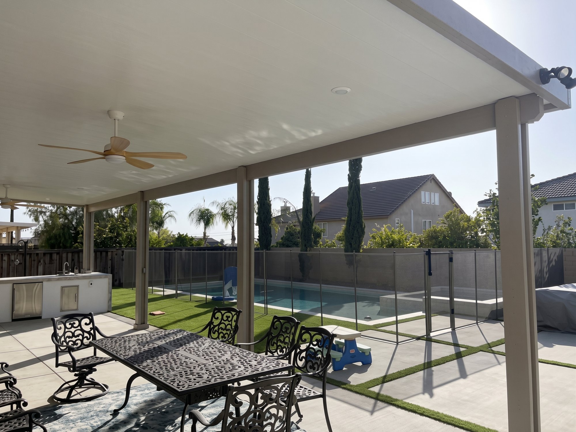 Completed solid aluminum patio cover installation in Riverside, California.