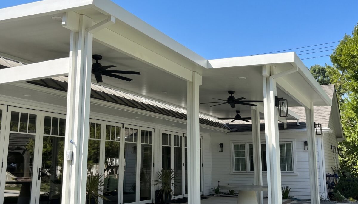 Finished white solid aluminum patio cover over a Riverside patio.